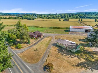This 93-ac farm has 3 parcels, 2 homes, barns, and outbuildings.