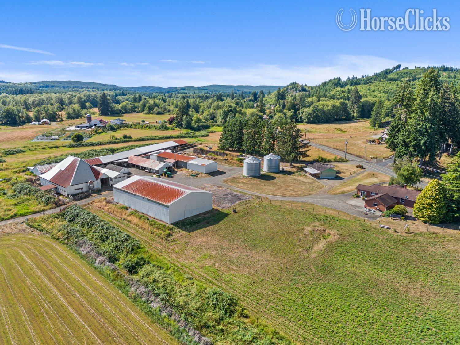 This 93-ac farm has 3 parcels, 2 homes, barns, and outbuildings.