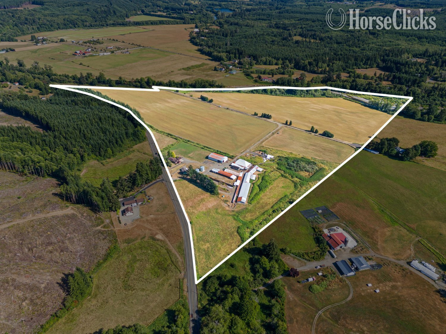 Washington This 93-ac farm has 3 parcels, 2 homes, barns, and outbuildings.